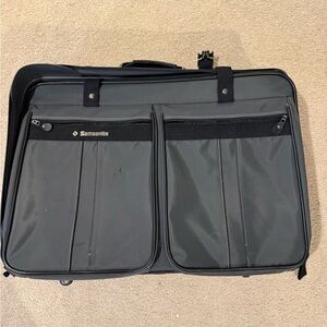 Samsonite Vintage luggage with rollers.